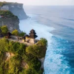 Pura Uluwatu terletak di Desa Adat Pecatu, Kecamatan Kuta Selatan, Kabupaten Badung, Bali